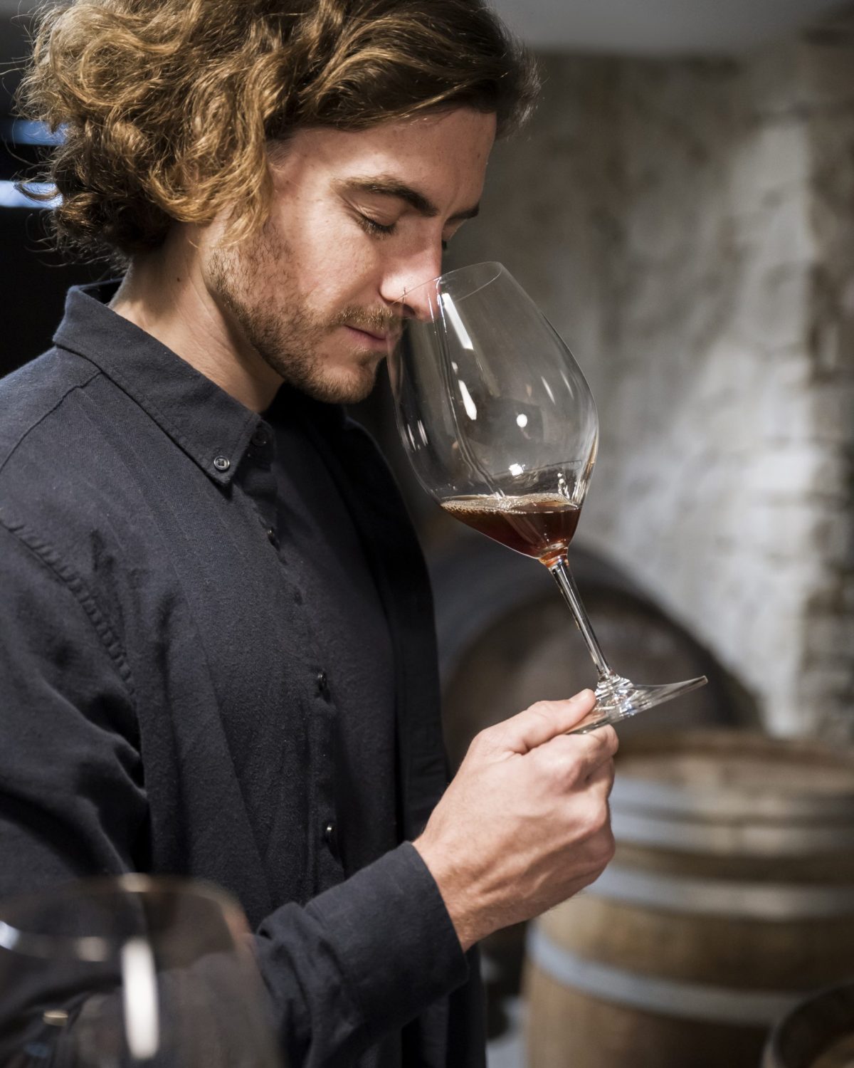 medium-shot-man-smelling-wine